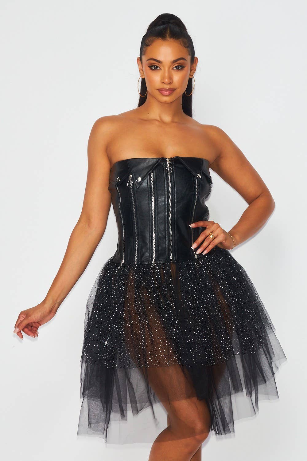 Kayla strapless gothic-punk mini dress featuring a black leather-look bodice, front zipper closure, multiple zipper accents and a voluminous glitter mesh tutu skirt at Blaire Shops.