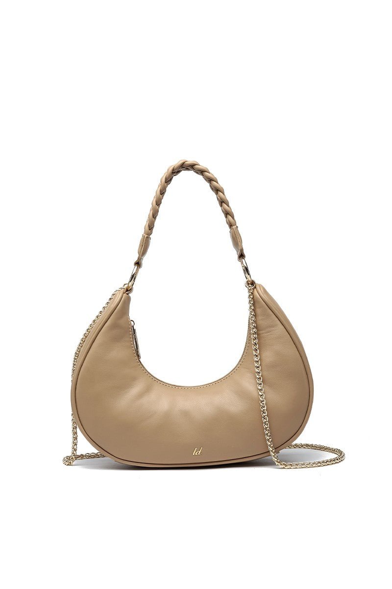 Like Dreams Nova convertible vegan leather shoulder bag featuring a sleek elongated silhouette, decorative chain-link accents, secure zipper closure, detachable top handle and removable crossbody strap, available at Blaire Shops.