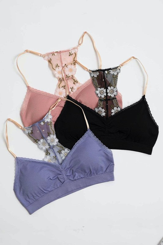 a group of four bras sitting next to each other