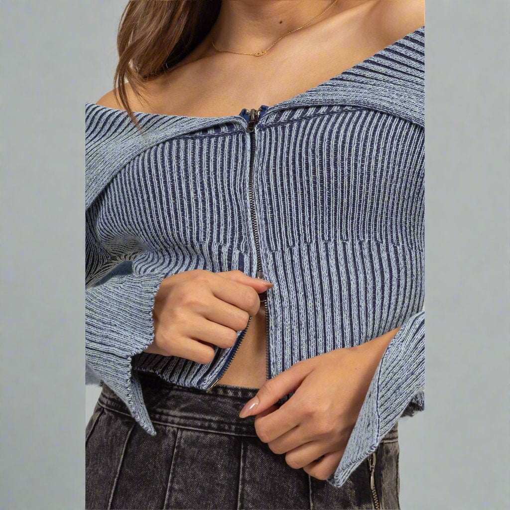 a woman wearing a blue and white striped top