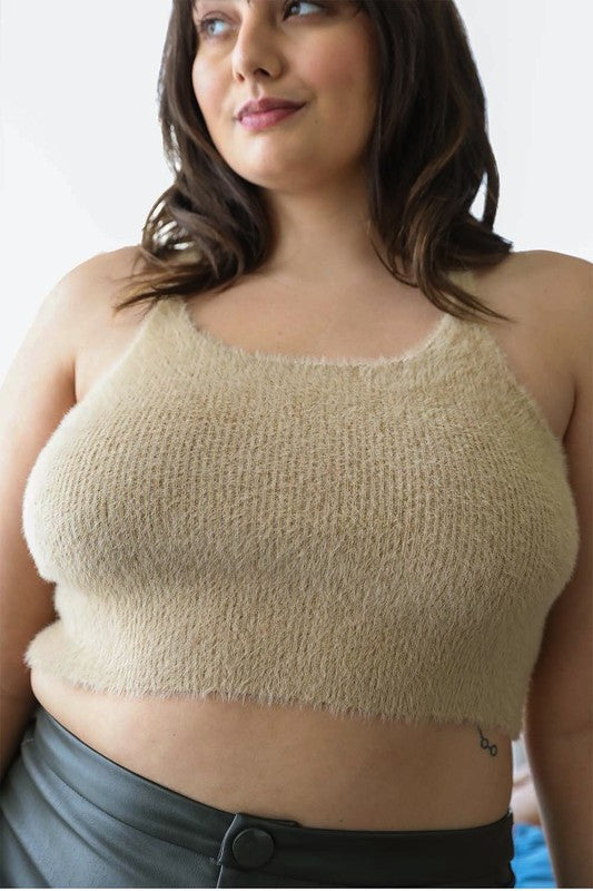 a woman wearing a tan crop top