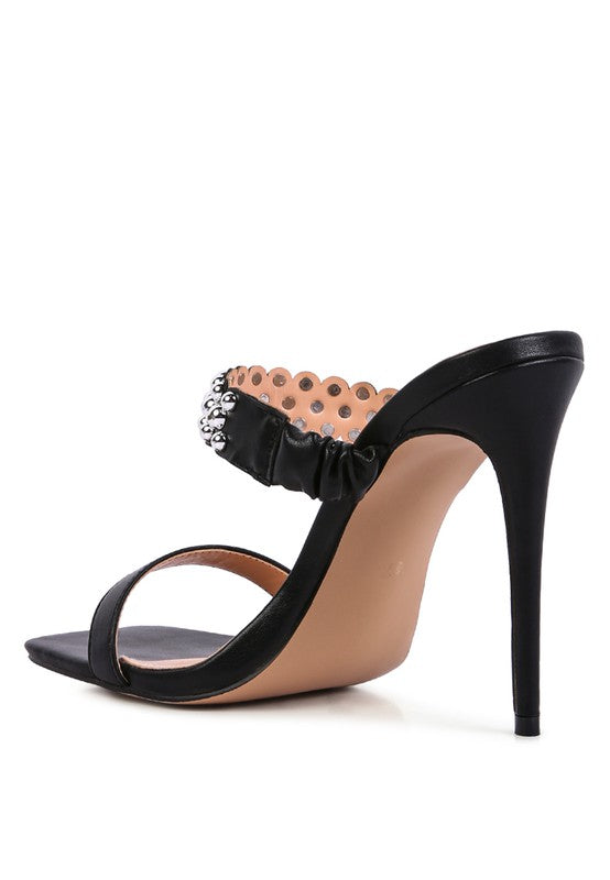 a woman's high heeled sandal with a bow