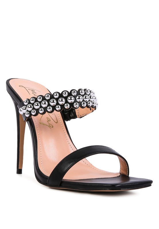 a women's black high heeled sandal with pearls