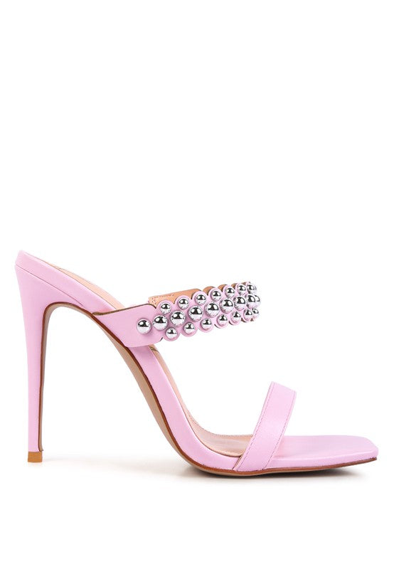 a pink high heeled sandal with a crystal embellishment