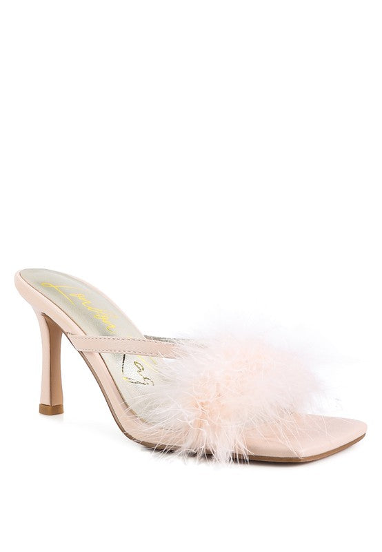 a women's shoe with a feather on the heel