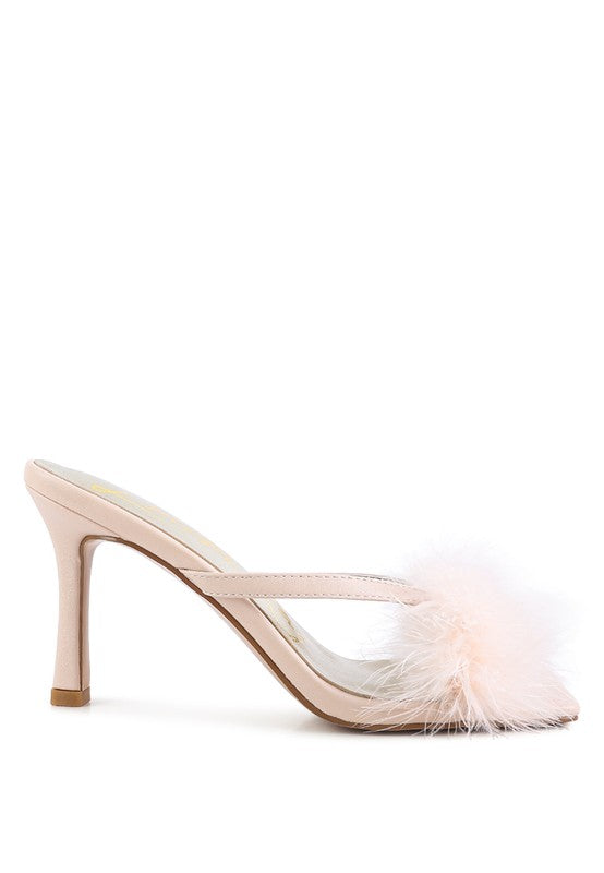 a women's shoe with a feather on the heel