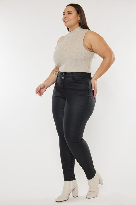 a woman wearing black pants and a beige top