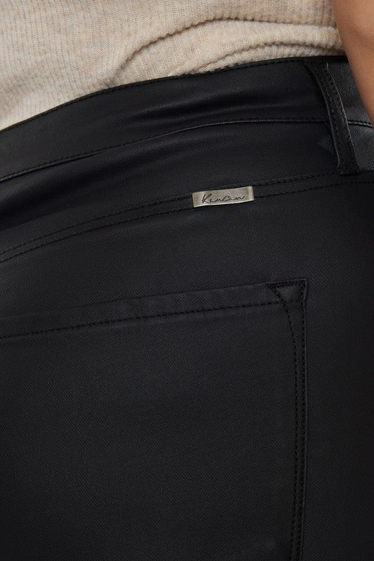 a close up of a person wearing black pants