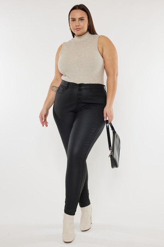 a woman wearing black pants and a turtle neck top