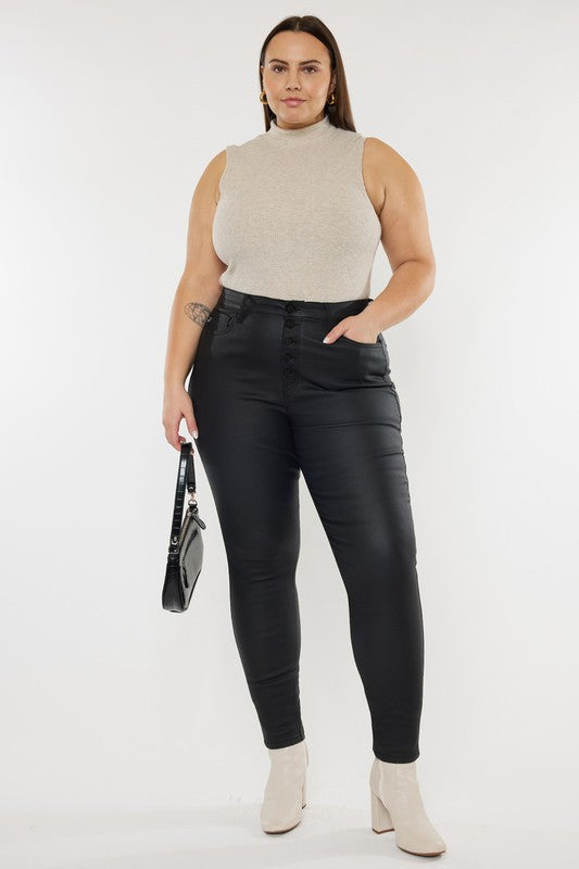 a woman wearing black pants and a beige top