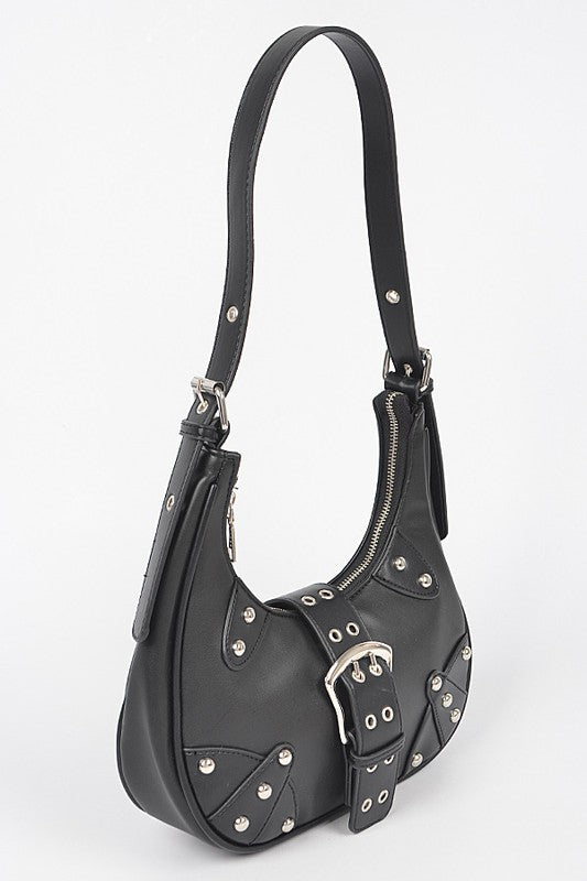 a black purse with silver studs on the handles