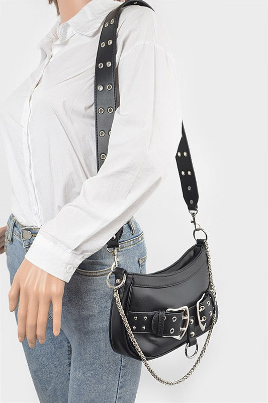 a woman wearing a white shirt holding a black purse