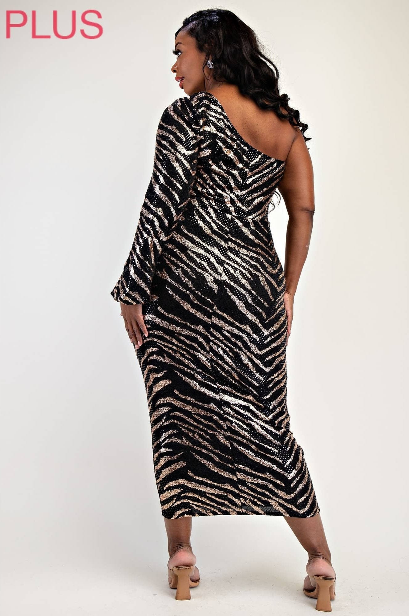 a woman in a zebra print dress