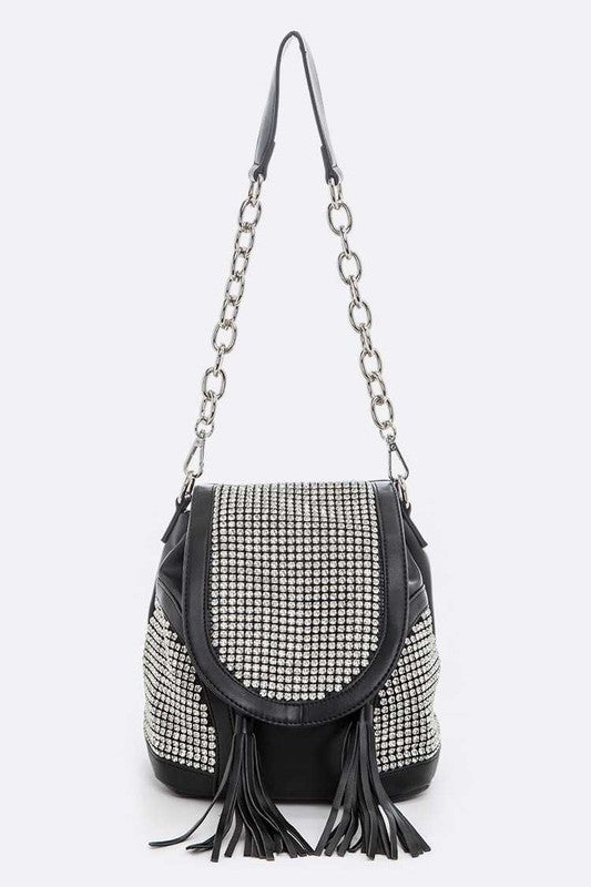 a black and white purse with a tasselled handle