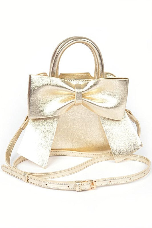 a gold purse with a bow on the front