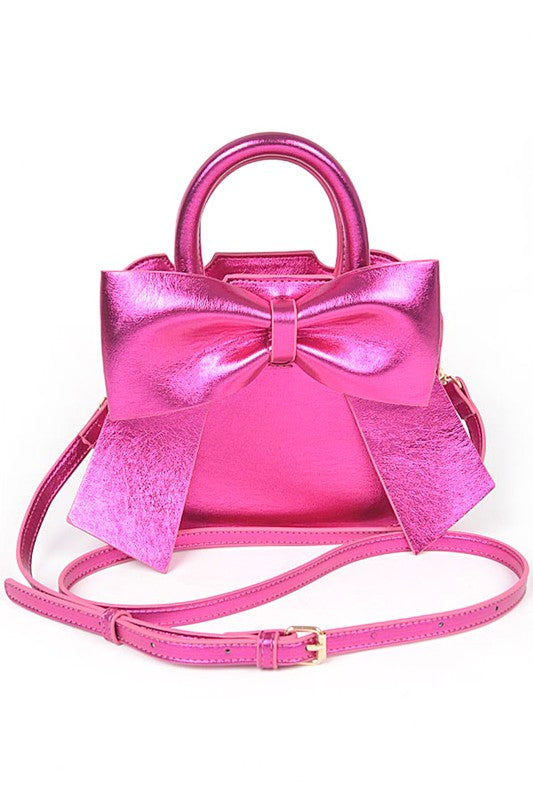 a pink purse with a bow on the front