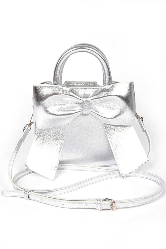 a silver purse with a bow on the front