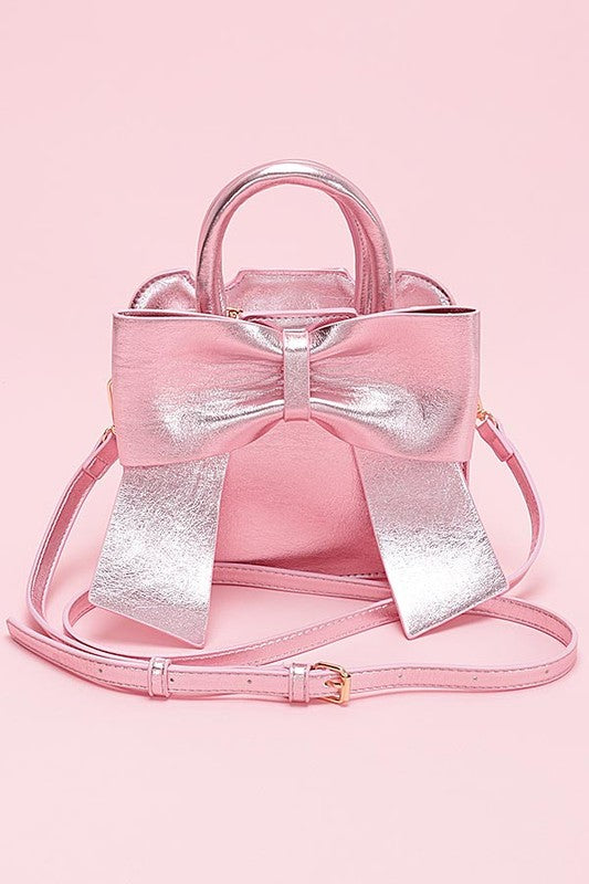 a pink purse with a bow on it