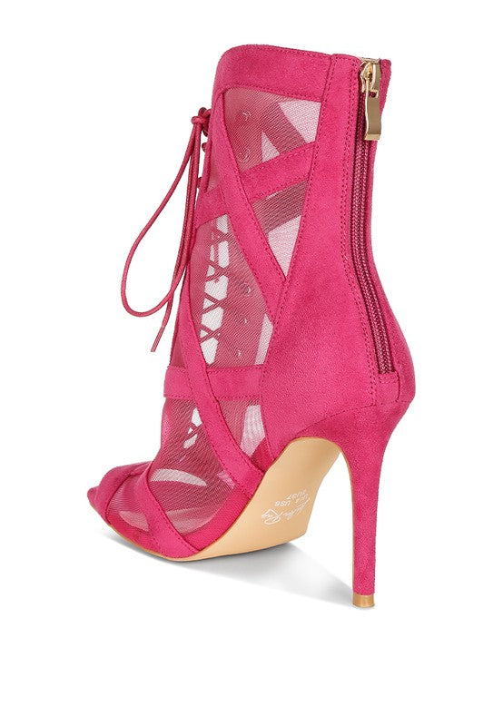 a pink high heeled shoe with a zipper