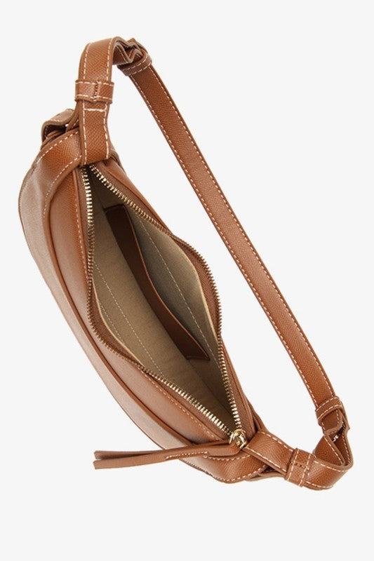 a brown handbag on a white background