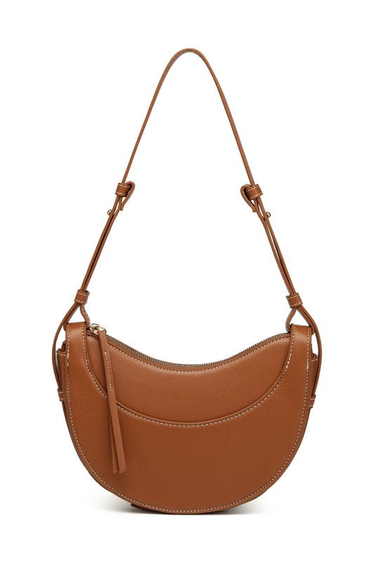 a brown purse with a tasselled strap