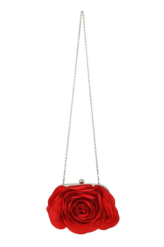 a red rose purse hanging from a chain