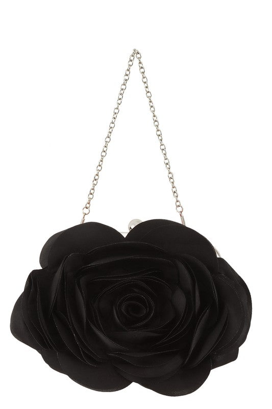 a black rose purse hanging from a chain