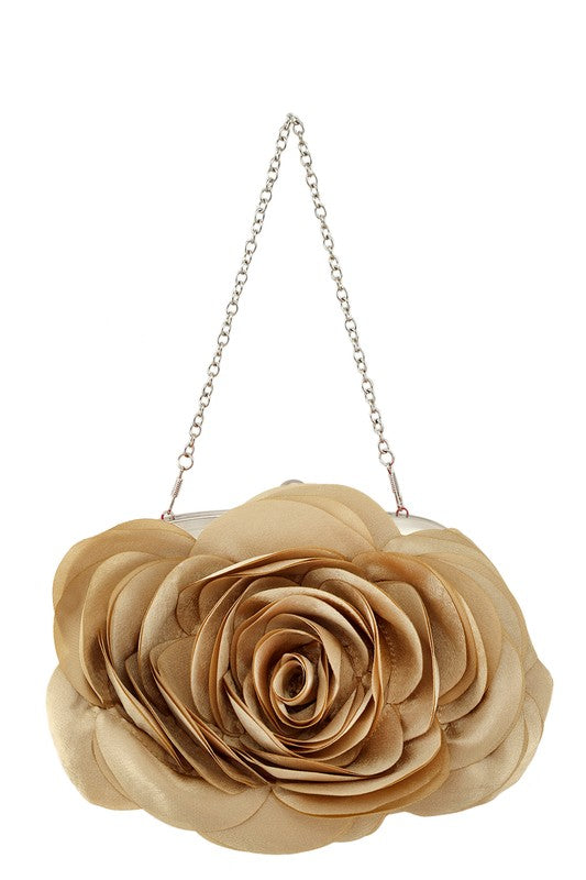 a handbag with a flower hanging from a chain