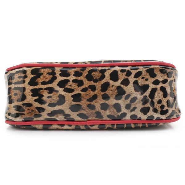 a leopard print purse with red trim