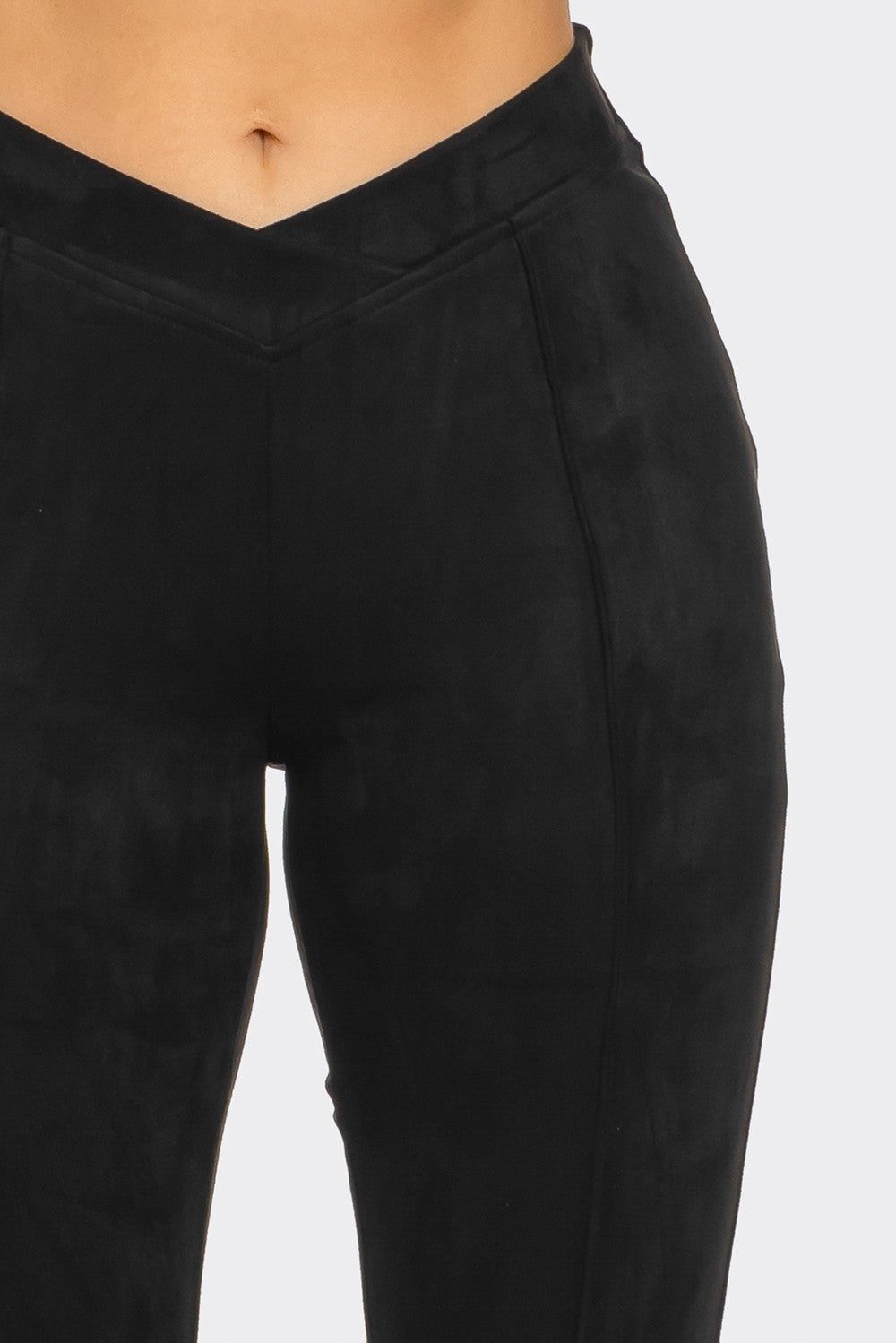 a close up of a person wearing black pants