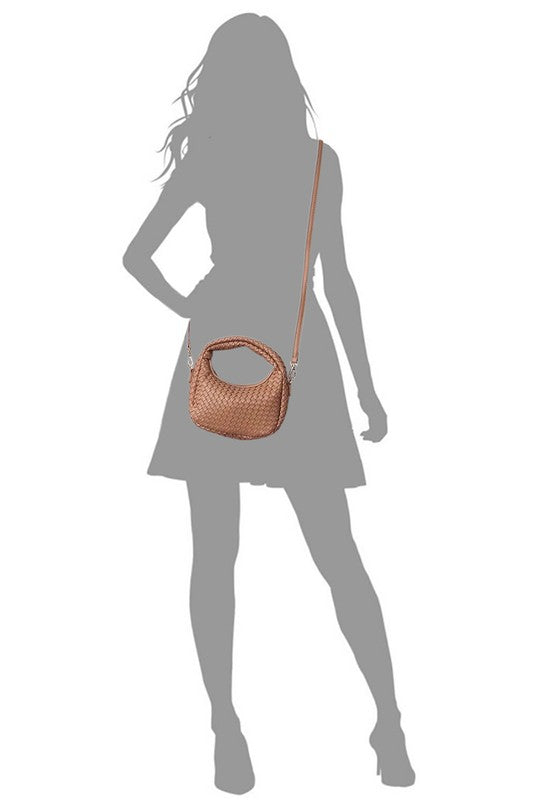 a woman in a dress holding a purse