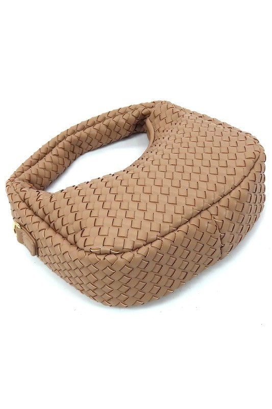 a brown woven bag on a white background