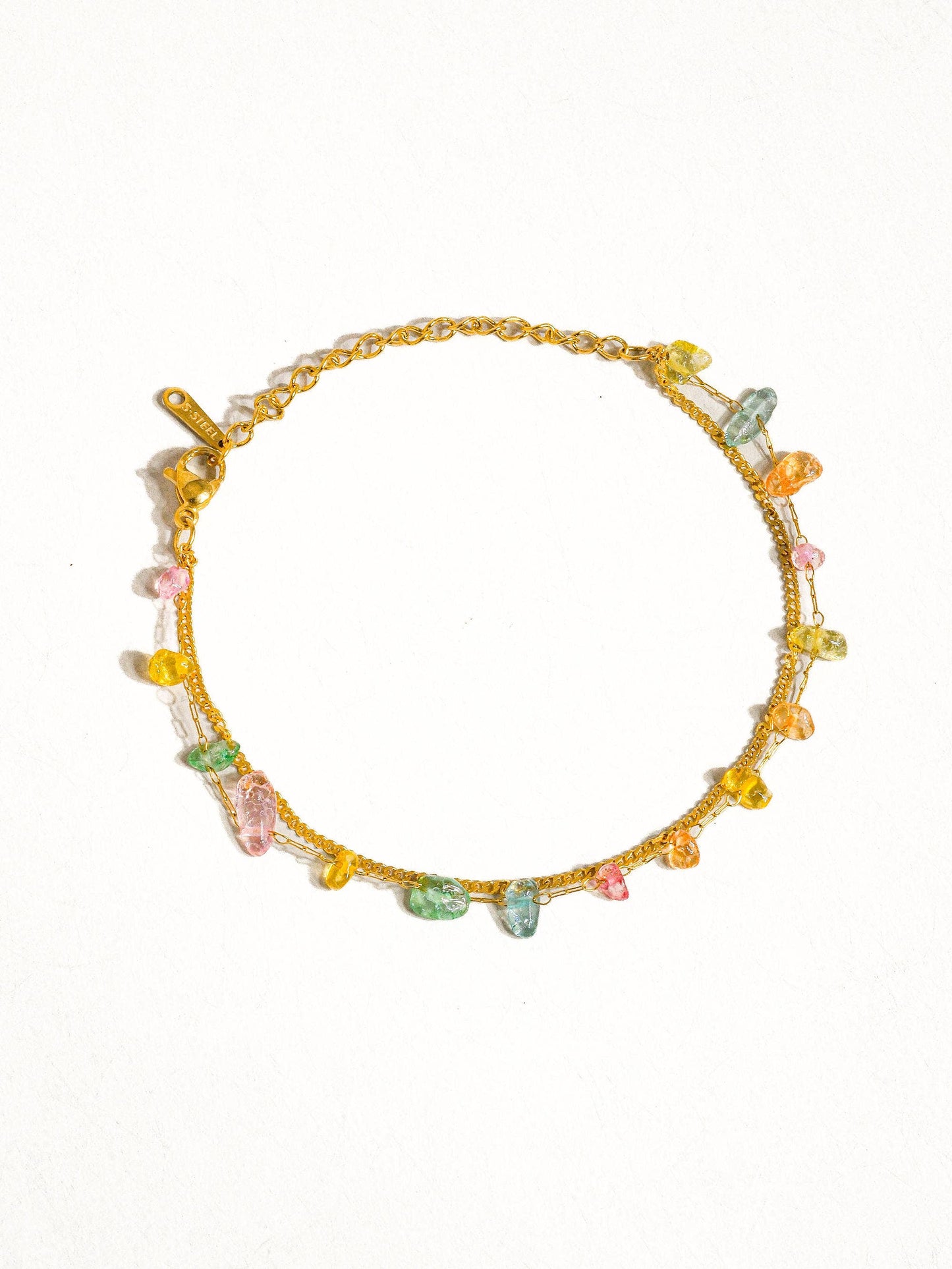 a gold bracelet with multicolored glass beads