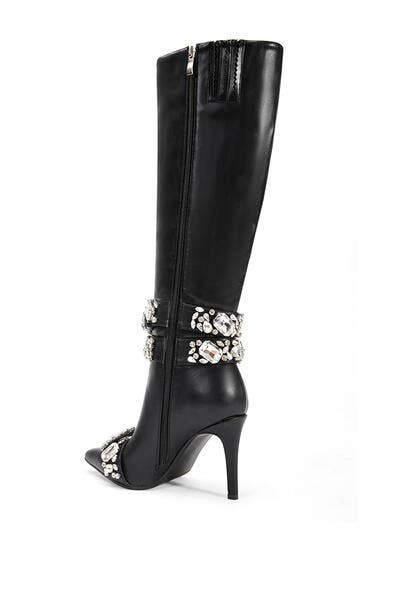 a pair of black high heeled boots