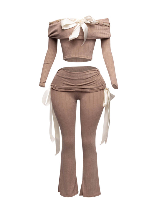 a mannequin wearing a cropped top and pants