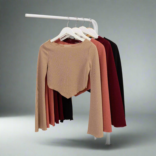 a rack of clothes hanging on a clothes rack