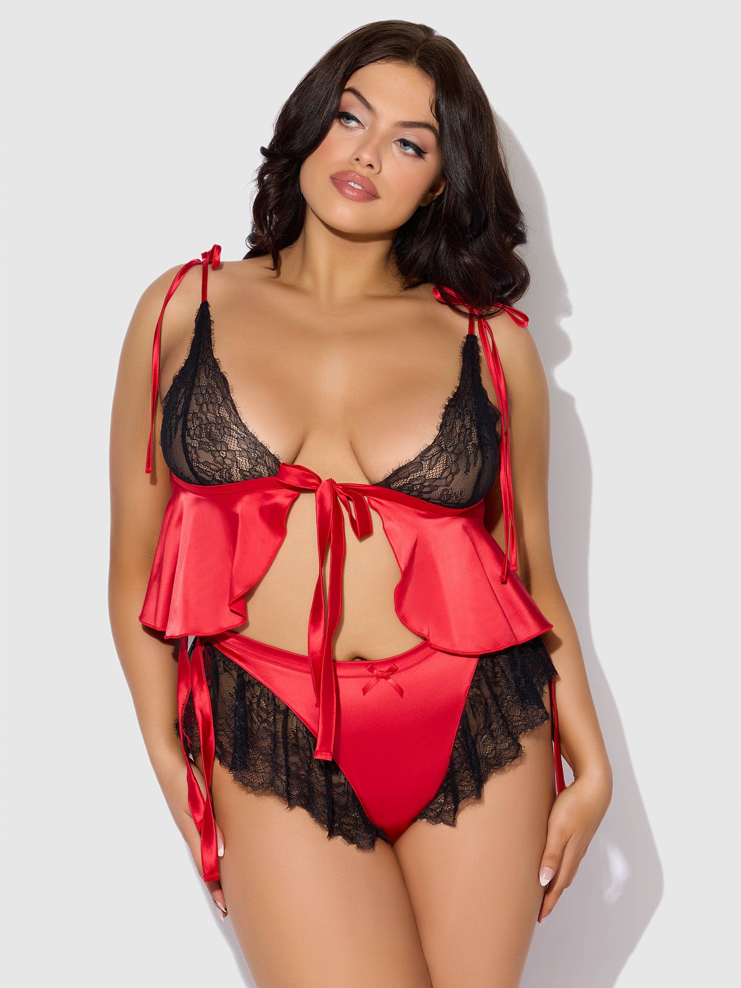 a woman wearing a red and black lingerie