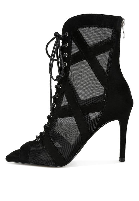 a black high heeled shoe with mesh detailing