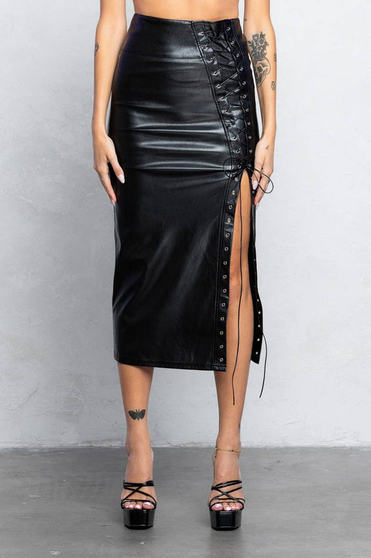 a woman wearing a black leather skirt with a side slit