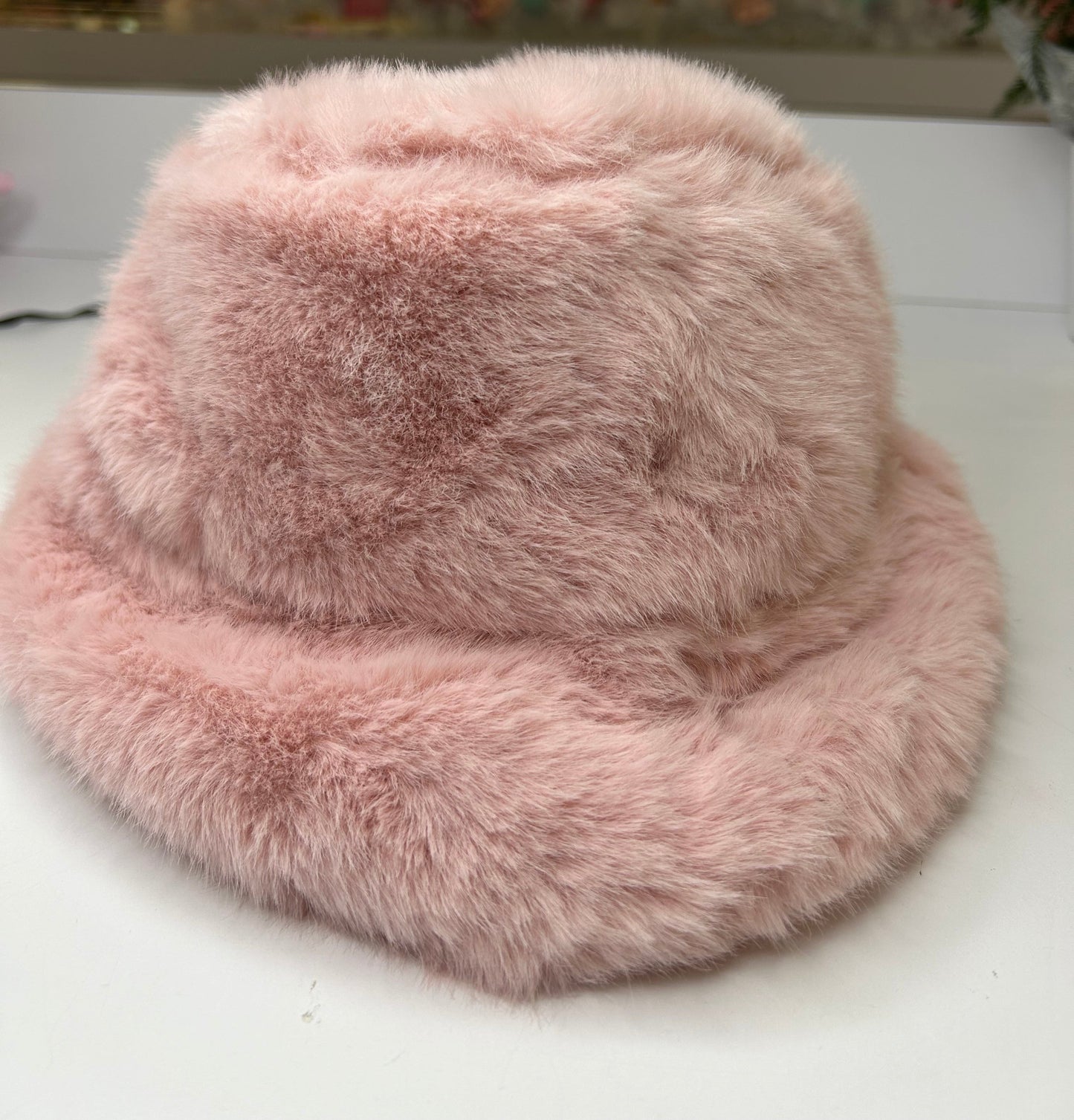 a pink hat sitting on top of a table