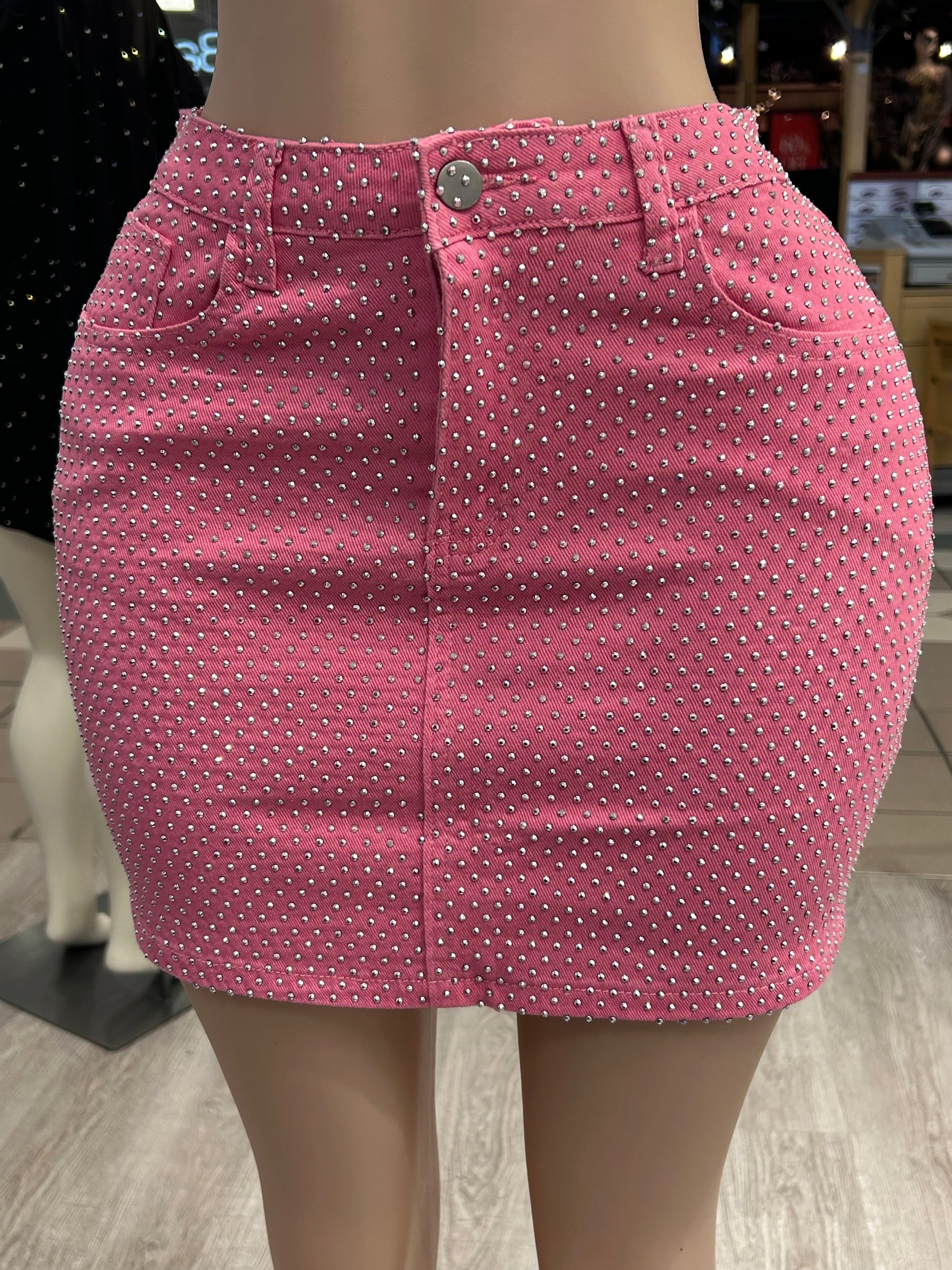 Back view of the Brianna Rhinestone Denim Mini Skirt that provides a flattering fit and modern look for any occasion.