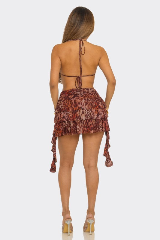 leopard print halter mini dress with plunging lace-trim cutout, open back, beaded detail, and tiered ruffle mesh skirt.