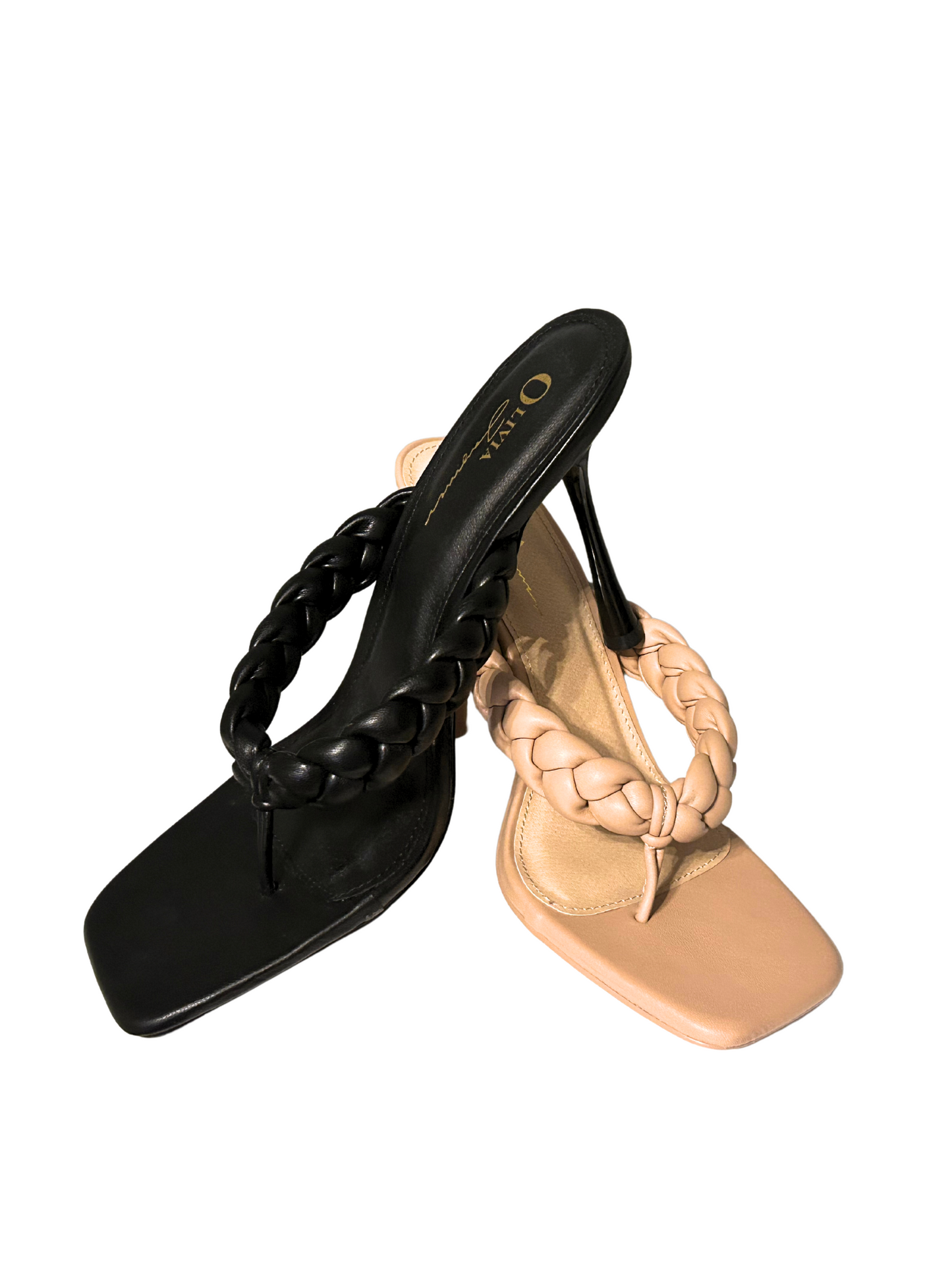 a pair of black and beige sandals with braids