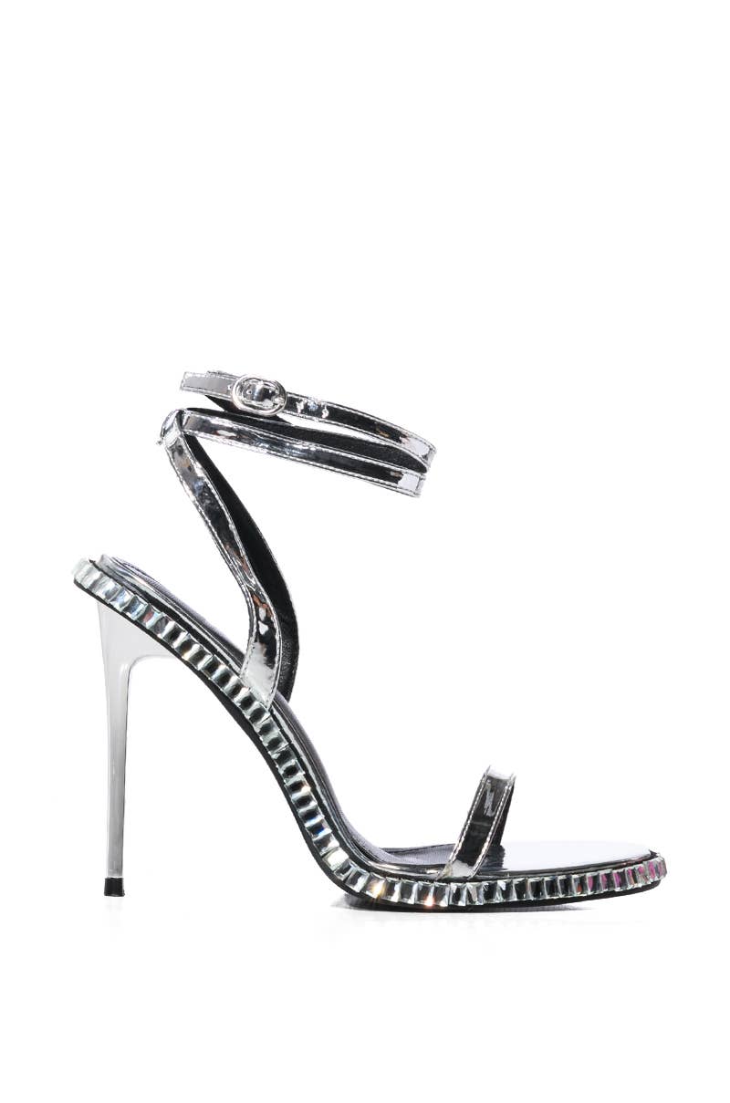 a high heeled sandal with a metallic finish