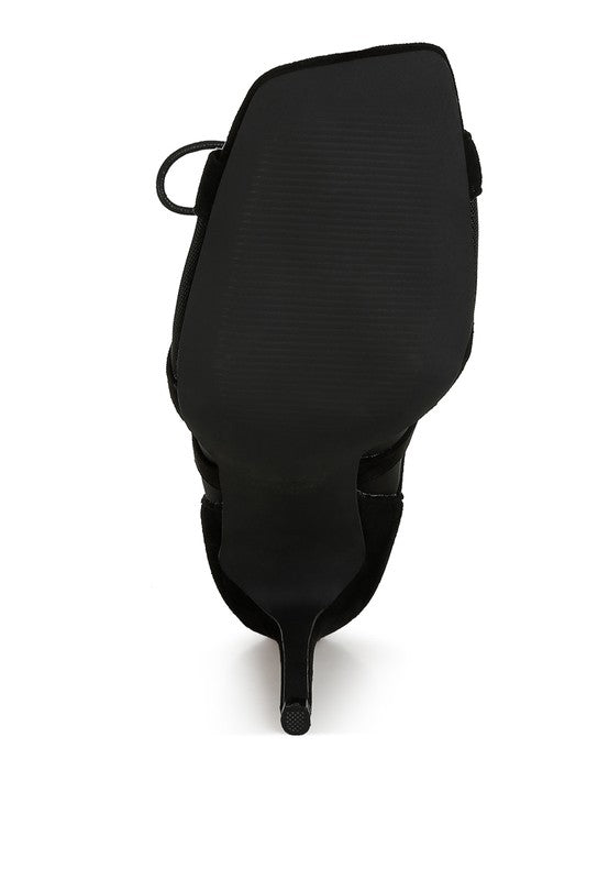 a close up of a black bag on a white background