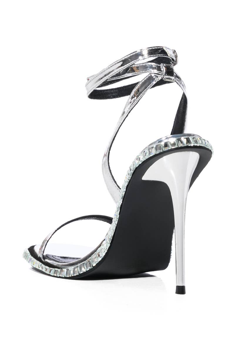 a pair of black and white high heels