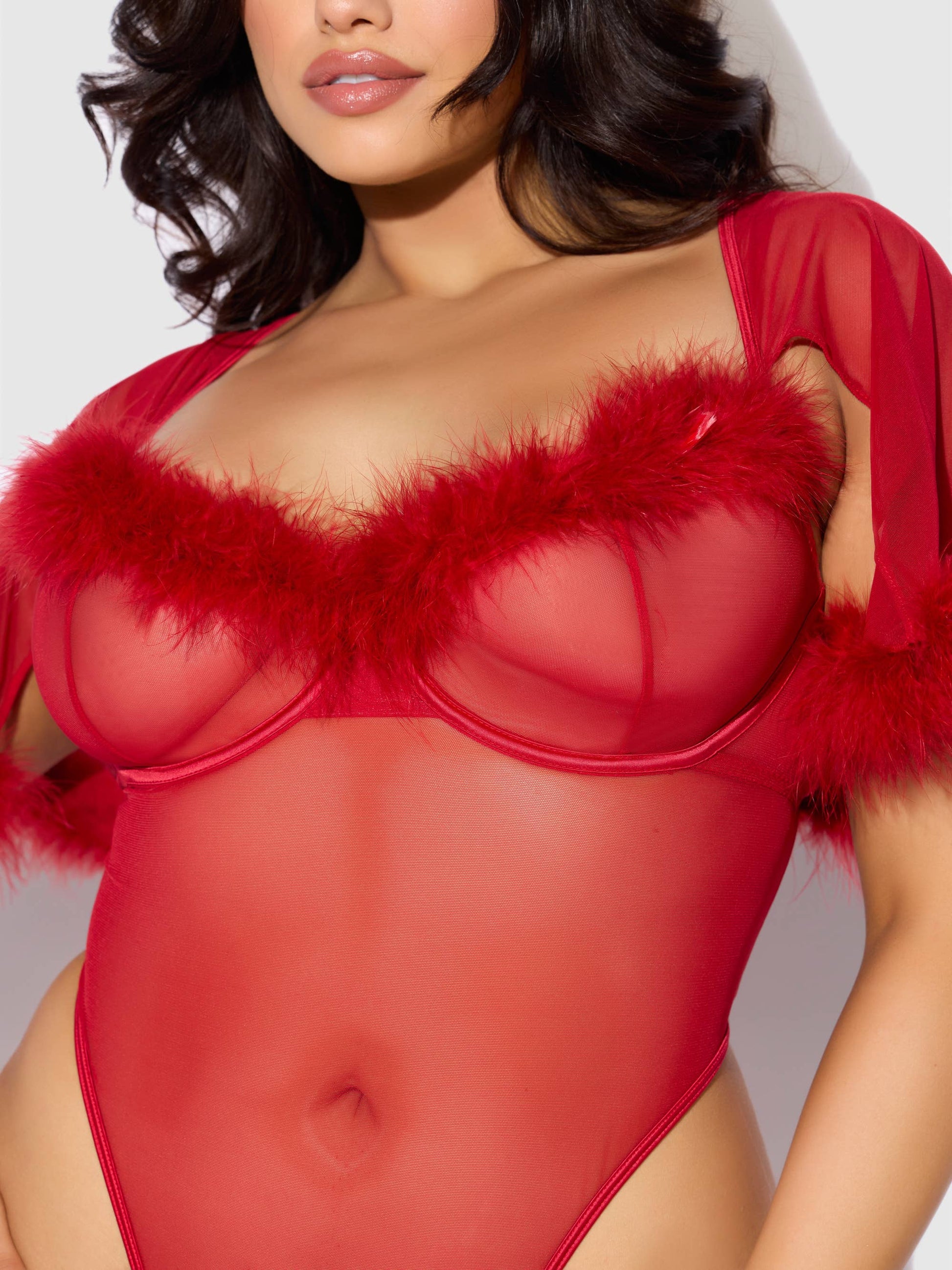 a woman in a red bodysuit with a fur collar