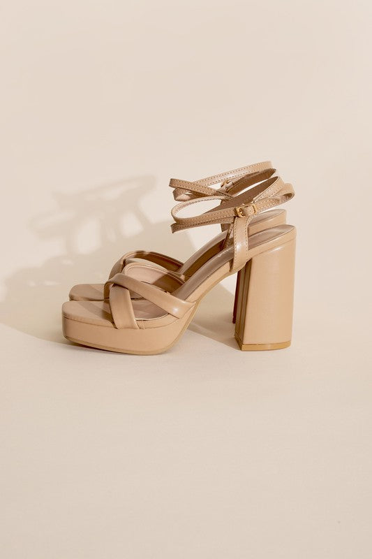 a women's sandal with two straps and a block heel