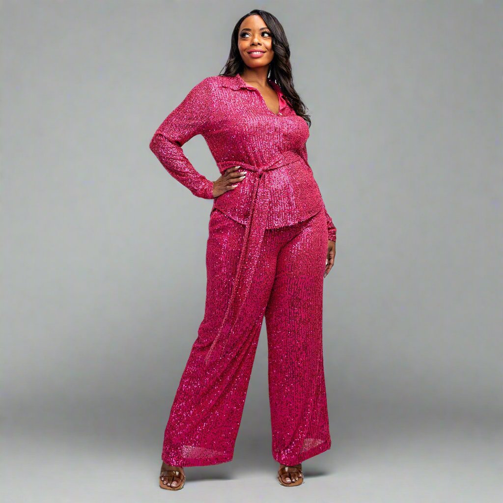 a woman in a pink jumpsuit posing for a picture