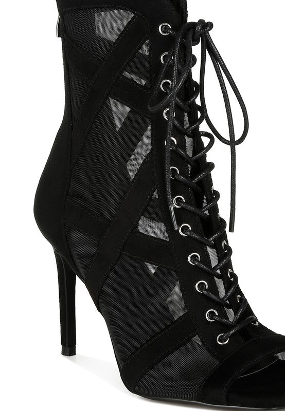 a pair of black high heeled shoes